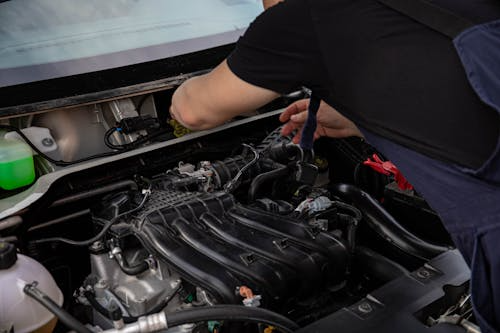 A car mechanic repairing a car engine