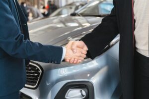 A person buys a car successfully.